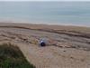 Simulation d'un fût échoué sur la plage